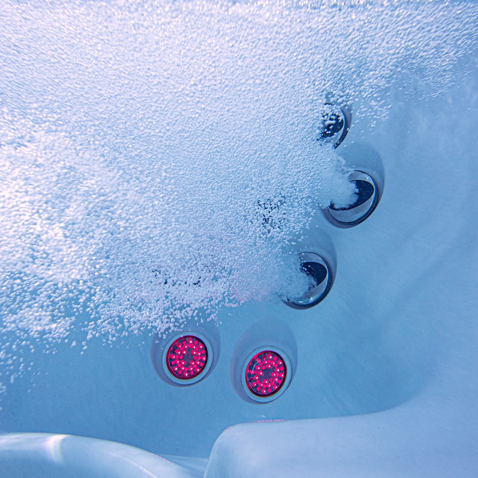 Jacuzzi J-400 Series > Product Highlights > Infrared + Red Light Therapy > Image 1 Champion Hot Tubs | Jacuzzi® J-435™ (Ex-display, no IR)