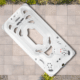 White outdoor hot tub with multiple seating areas and numerous jet nozzles on a tiled patio.